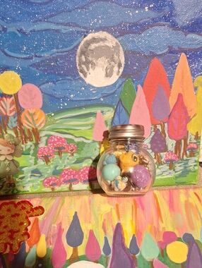 Glass Jar Filled with Colorful And Playful Trinkets And Toys.